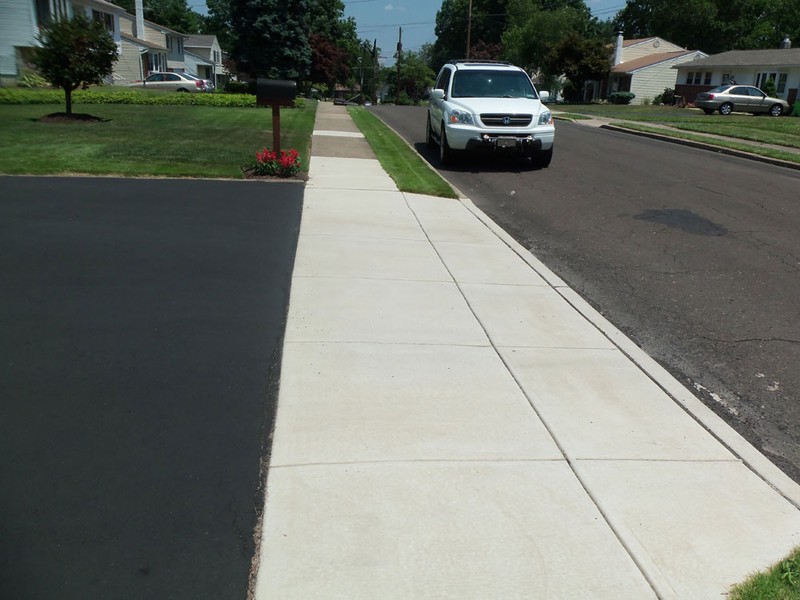 concrete sidewalk and driveway apron