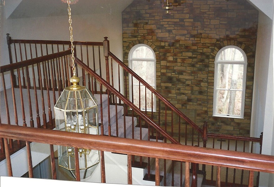 floor to ceiling stone wall in living room