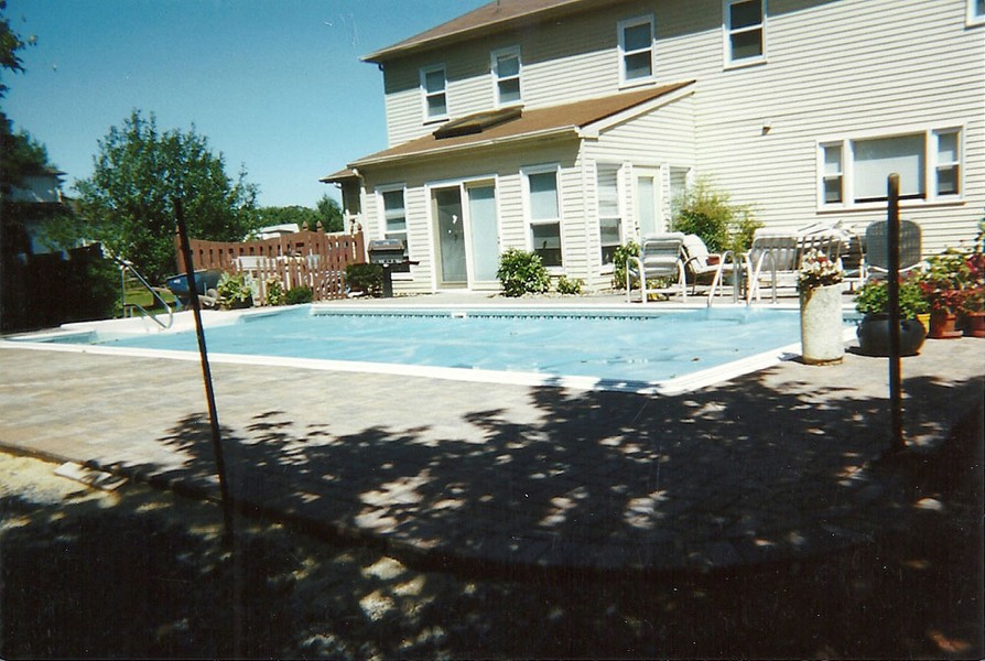 professionally installed pavers around the pool