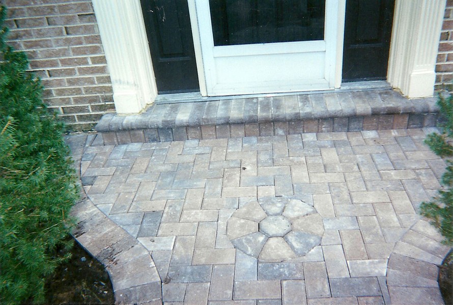 front of home paver walkway with design