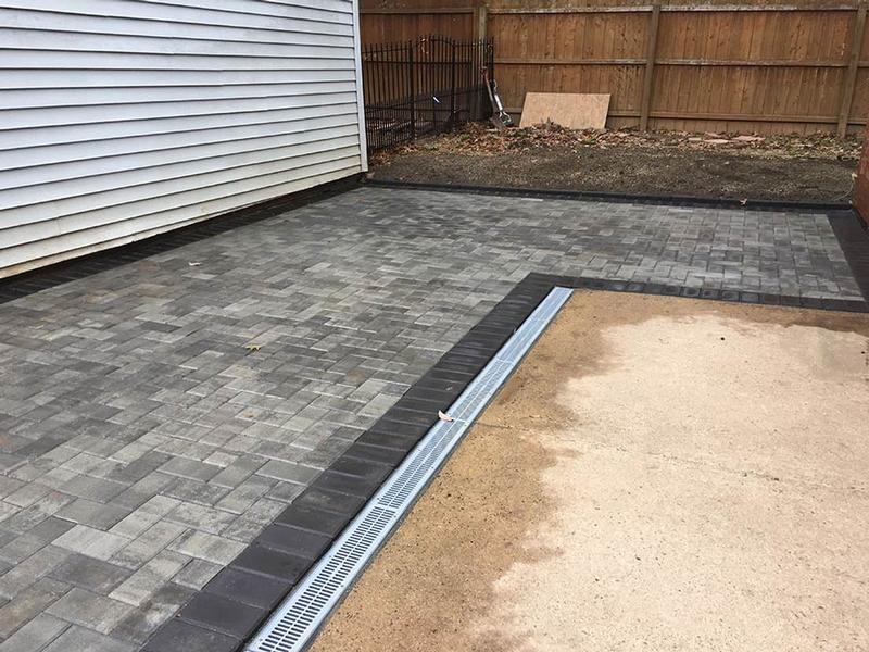 light gray hardscaping outlined by dark grey