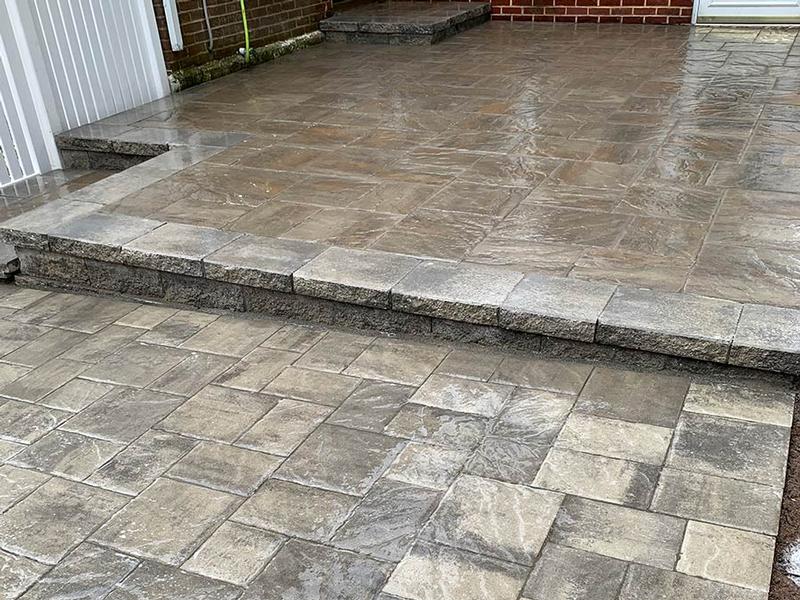 two tiered hardscape patio multi tone brown and gray