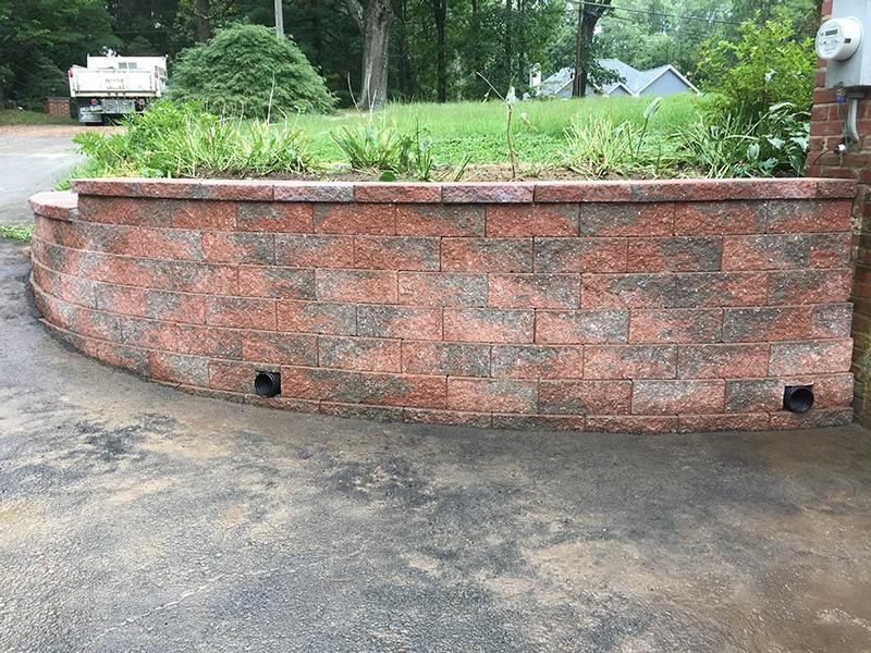 red curved stone retaining wall